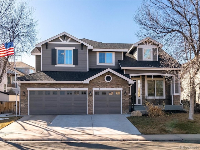 craftsman-style house featuring a garage and covered porch