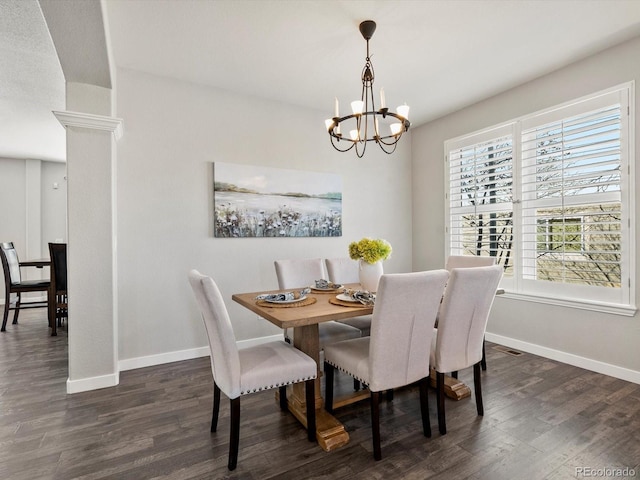 dining area featuring dark hardwood / wood-style flooring and a notable chandelier