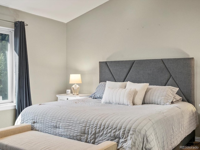 bedroom featuring multiple windows