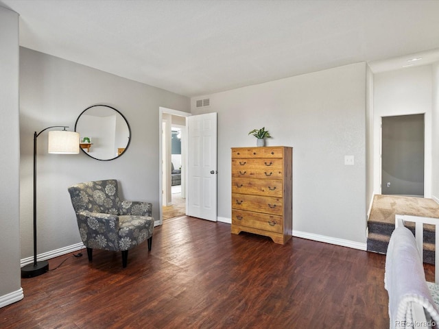 sitting room featuring dark wood-type flooring