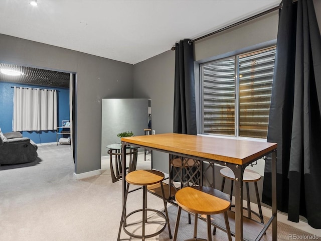 view of carpeted dining space