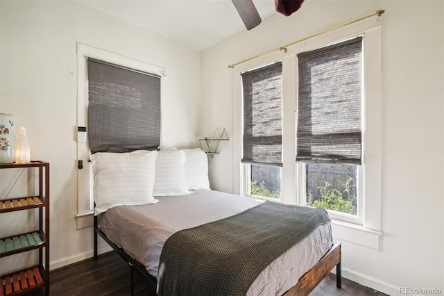 bedroom featuring ceiling fan and dark hardwood / wood-style flooring