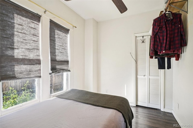 bedroom featuring wood-type flooring, a closet, and ceiling fan