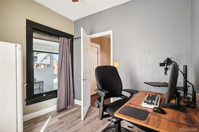 office area with light hardwood / wood-style flooring