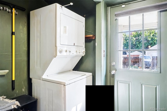 laundry room with stacked washer and clothes dryer