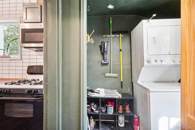 laundry room featuring stacked washing maching and dryer