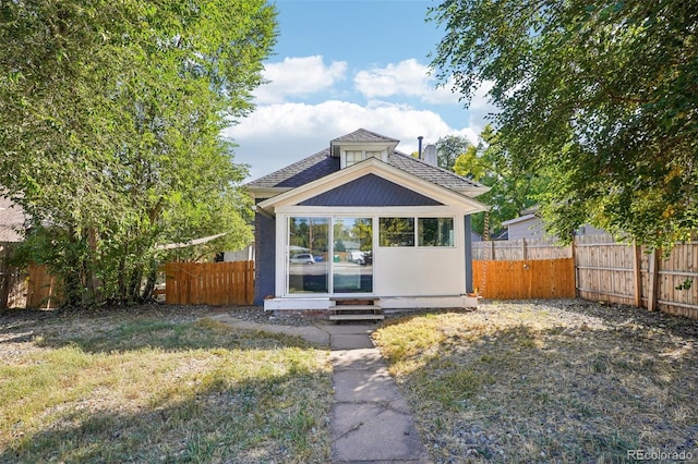 view of outdoor structure featuring a lawn