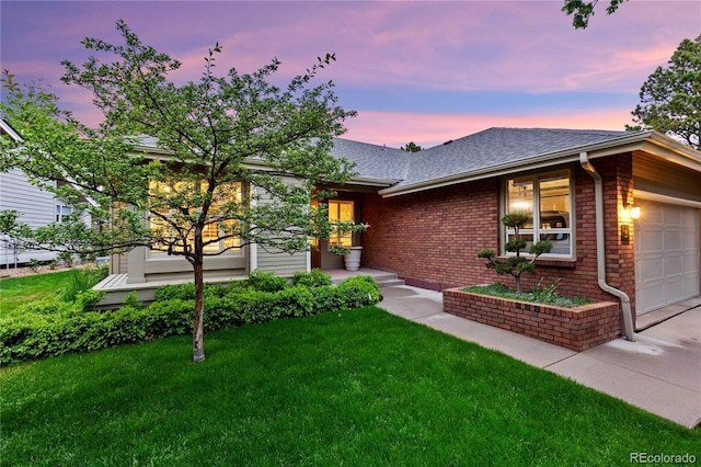 13 Pinyon Pine Rd, Littleton, CO 80127 - ranch-style home with a garage, brick siding, a shingled roof, a lawn, and concrete driveway