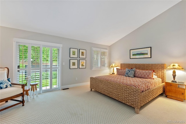 13 Pinyon Pine Rd, Littleton, CO 80127 - bedroom with light colored carpet, multiple windows, baseboards, vaulted ceiling, and access to outside