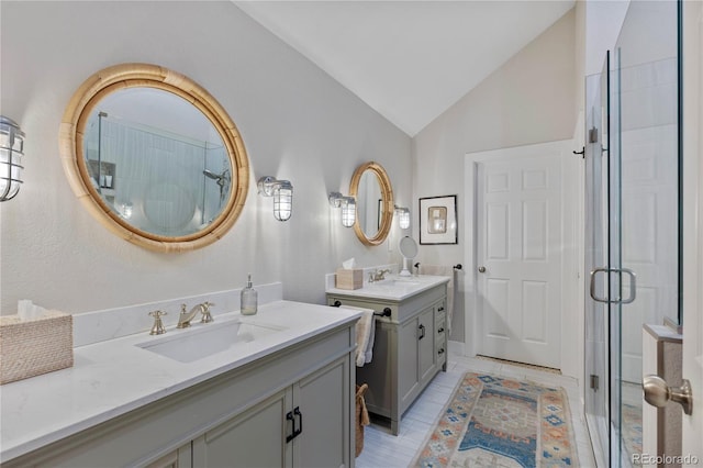 13 Pinyon Pine Rd, Littleton, CO 80127 - full bathroom with lofted ceiling, two vanities, and a stall shower