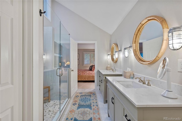 13 Pinyon Pine Rd, Littleton, CO 80127 - full bath featuring vanity, a stall shower, tile patterned floors, lofted ceiling, and connected bathroom