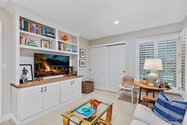 13 Pinyon Pine Rd, Littleton, CO 80127 - living area with baseboards, light carpet, recessed lighting, and built in features