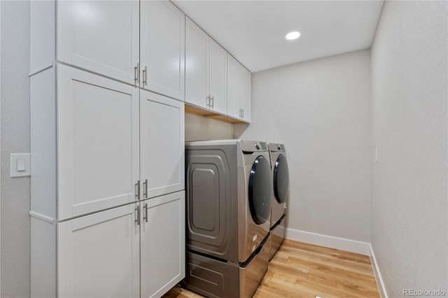 13 Pinyon Pine Rd, Littleton, CO 80127 - laundry area featuring washer and dryer, cabinet space, light wood-style flooring, baseboards, and recessed lighting