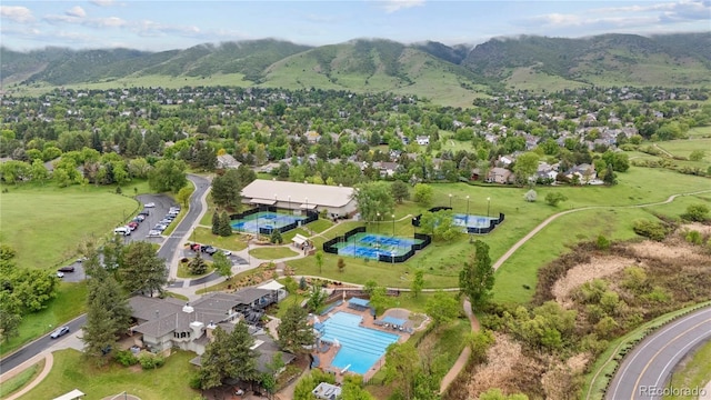 13 Pinyon Pine Rd, Littleton, CO 80127 - aerial view of property and surrounding area with a mountainous background and a pool area