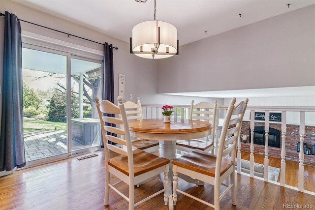 dining space with wood finished floors