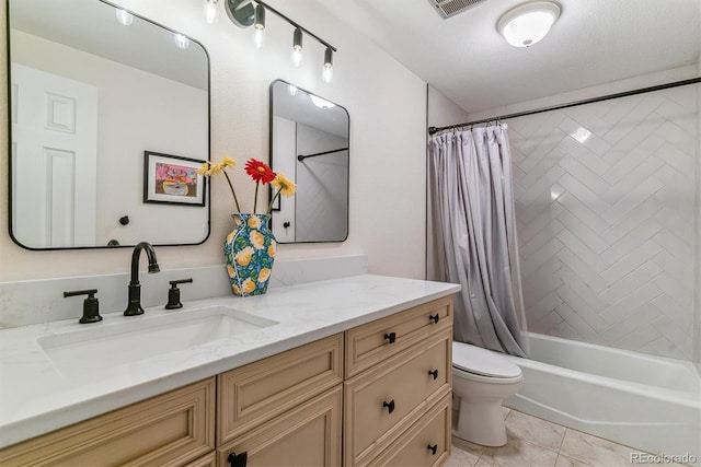 full bath featuring toilet, shower / tub combo with curtain, vanity, and tile patterned flooring