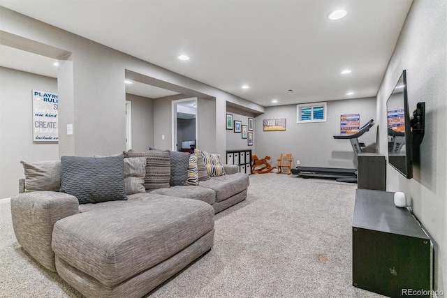 living room featuring recessed lighting and carpet