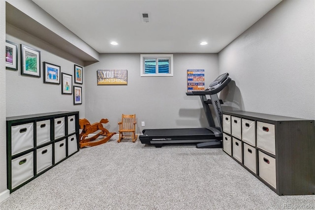workout room with carpet floors and recessed lighting