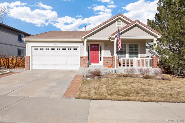 view of front of house with concrete driveway, covered porch, brick siding, and an attached garage