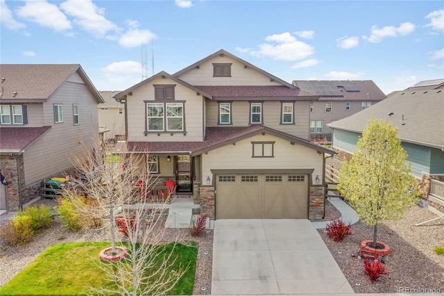 craftsman inspired home with concrete driveway, stone siding, a shingled roof, a porch, and a garage