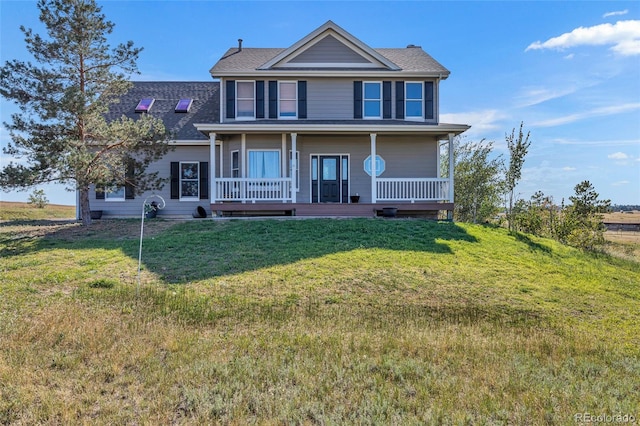 view of front of home with a front yard and a porch