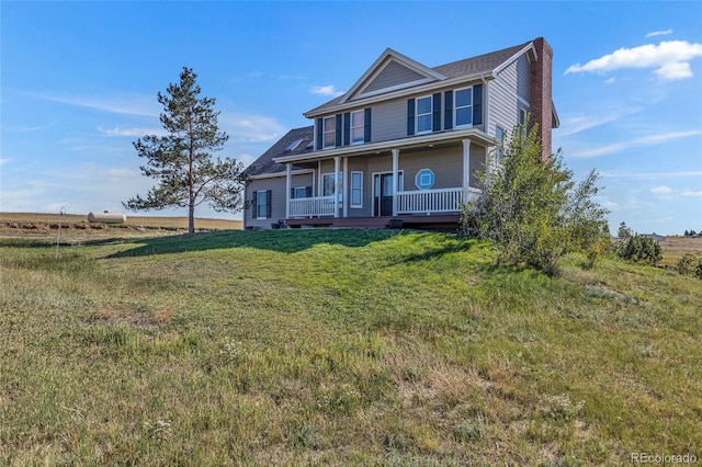 6696 Sunset Cir, Kiowa, CO 80117 - view of front of house with a porch, a chimney, and a front yard