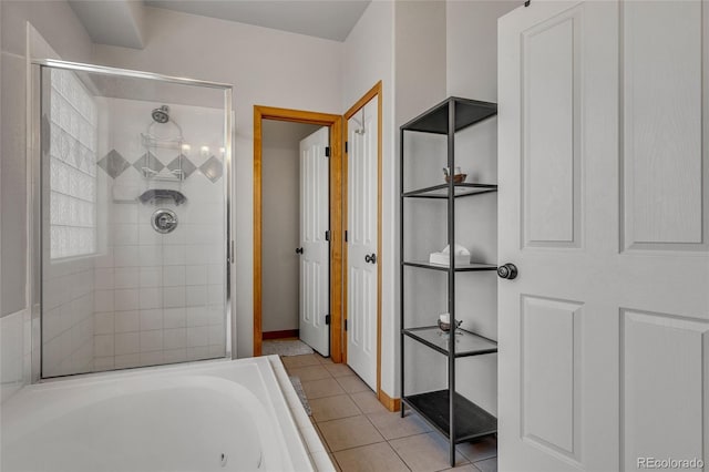 6696 Sunset Cir, Kiowa, CO 80117 - full bath with tiled shower, a jetted tub, tile patterned flooring, and baseboards