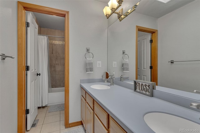 bathroom with tile patterned flooring, shower / tub combo, and vanity