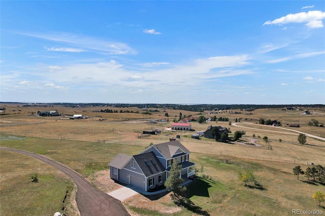 birds eye view of property featuring a rural view