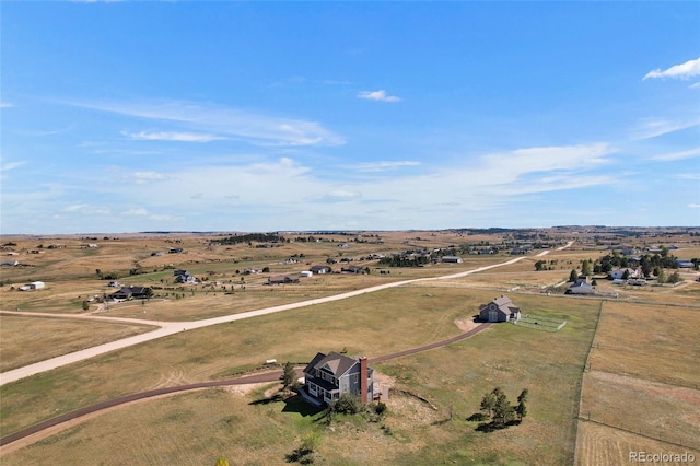 birds eye view of property featuring a rural view