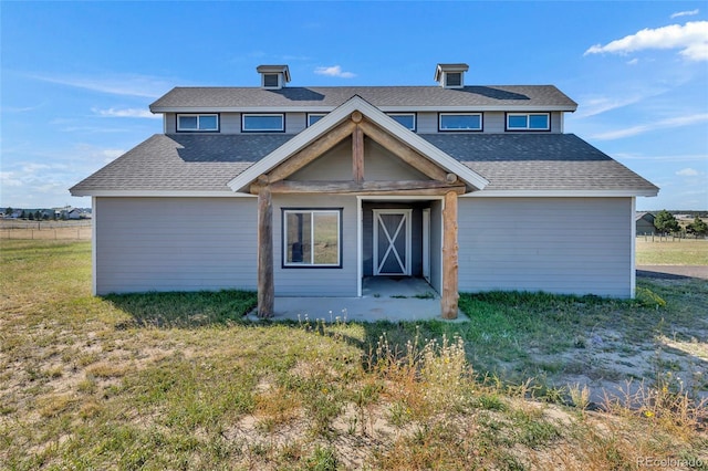 view of front of home with a front lawn