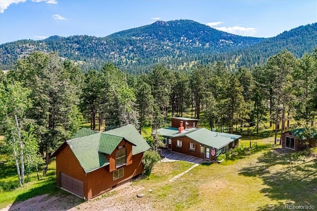 5818 S Skyline Dr, Evergreen, CO 80439 - aerial view of property and surrounding area featuring a forest and a mountain backdrop