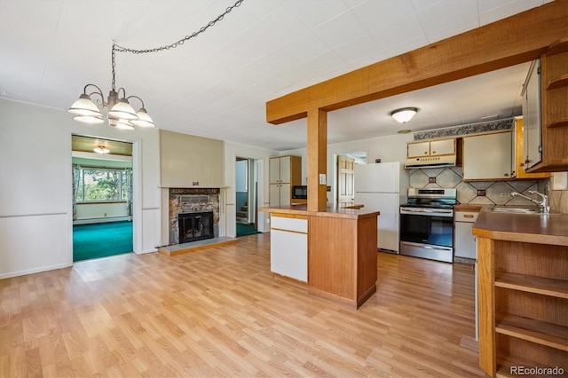 5818 S Skyline Dr, Evergreen, CO 80439 - kitchen featuring electric range, freestanding refrigerator, open shelves, under cabinet range hood, and light wood-style floors