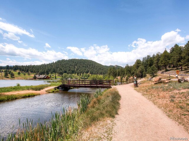 5818 S Skyline Dr, Evergreen, CO 80439 - water view with a forest