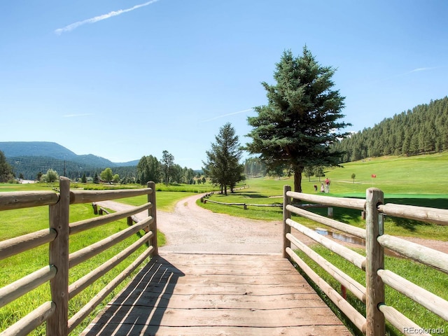 5818 S Skyline Dr, Evergreen, CO 80439 - deck featuring a mountain view and a yard
