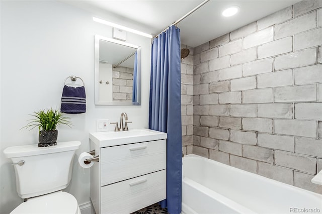 full bathroom featuring toilet, vanity, and shower / bathtub combination with curtain