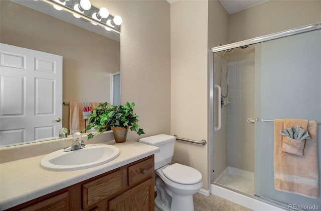 1343 Villa Grv, Monument, CO 80132 - bathroom featuring a stall shower, toilet, vanity, and tile patterned floors