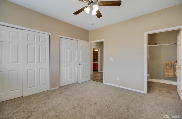 1343 Villa Grv, Monument, CO 80132 - unfurnished bedroom featuring multiple closets, carpet, baseboards, and connected bathroom