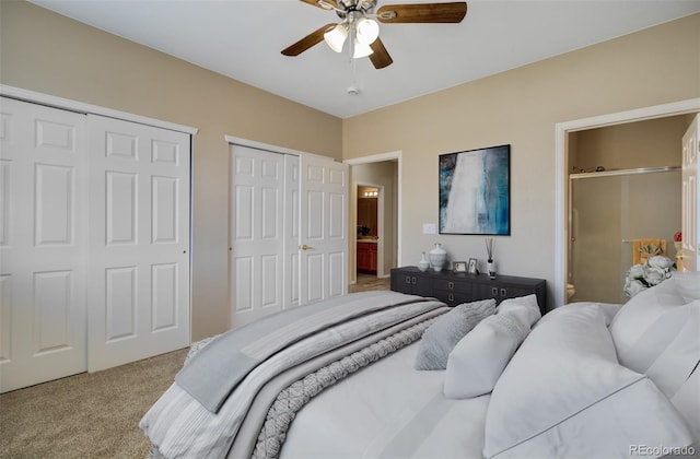 1343 Villa Grv, Monument, CO 80132 - bedroom with two closets, carpet floors, connected bathroom, and ceiling fan