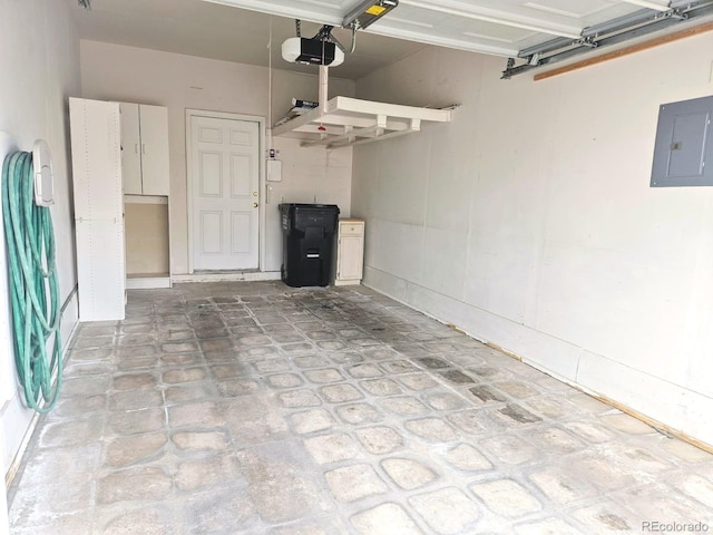 1343 Villa Grv, Monument, CO 80132 - garage featuring a garage door opener and electric panel