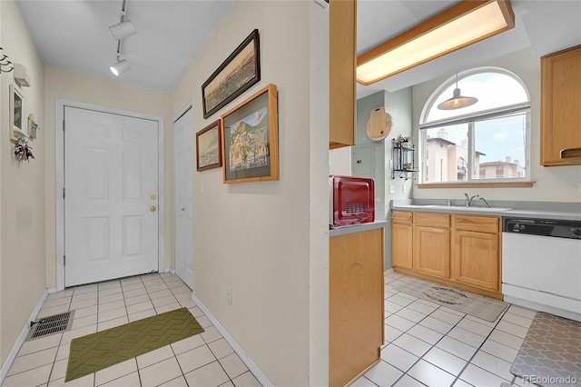 2850 Aurora Ave Unit 301, Boulder, CO 80303 - kitchen featuring dishwasher, light tile patterned flooring, light countertops, and track lighting