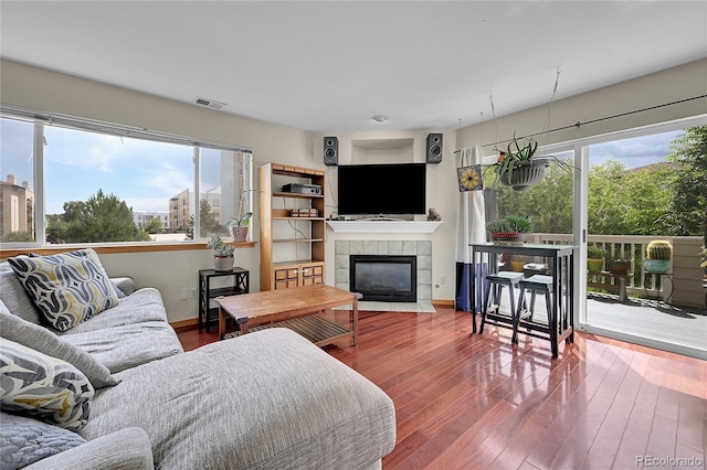 2850 Aurora Ave Unit 301, Boulder, CO 80303 - living room with wood finished floors and a fireplace