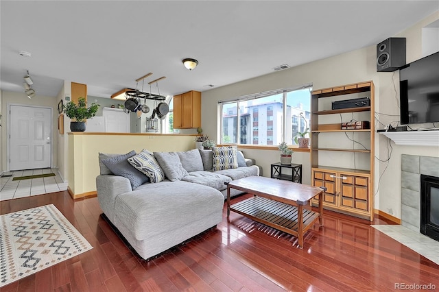 2850 Aurora Ave Unit 301, Boulder, CO 80303 - living area with a tiled fireplace and wood finished floors