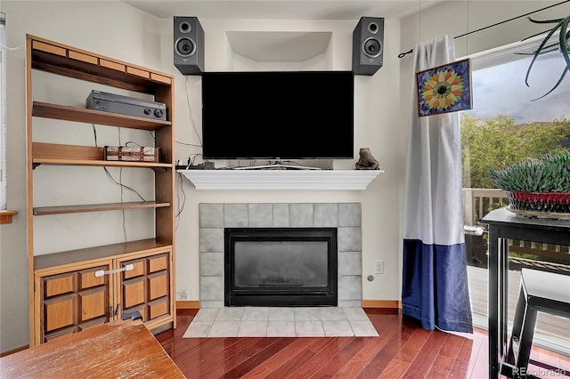 2850 Aurora Ave Unit 301, Boulder, CO 80303 - living room featuring wood finished floors and a tiled fireplace