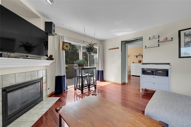 2850 Aurora Ave Unit 301, Boulder, CO 80303 - living room with wood finished floors and a tile fireplace