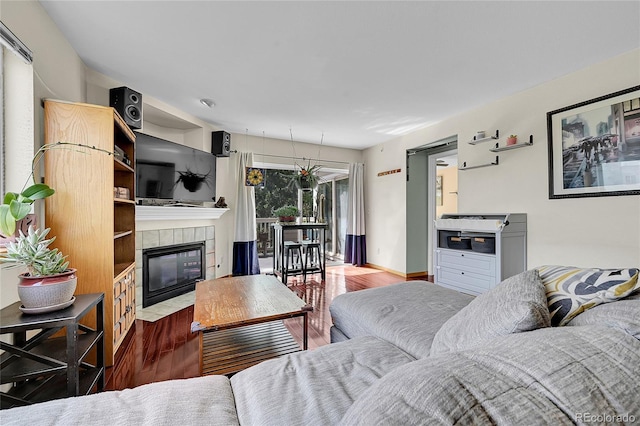 2850 Aurora Ave Unit 301, Boulder, CO 80303 - living room featuring wood finished floors and a fireplace