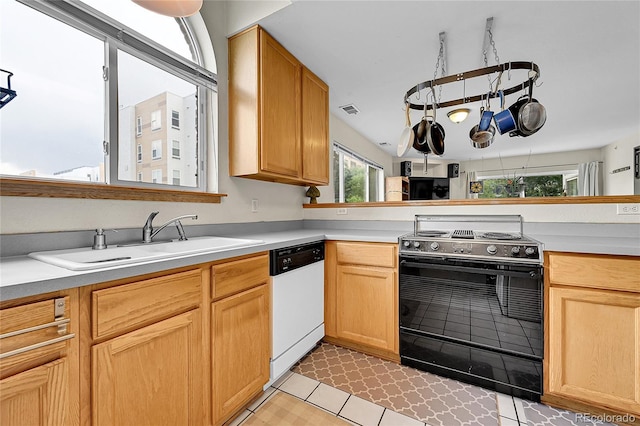2850 Aurora Ave Unit 301, Boulder, CO 80303 - kitchen with dishwasher, black range with electric cooktop, and light countertops