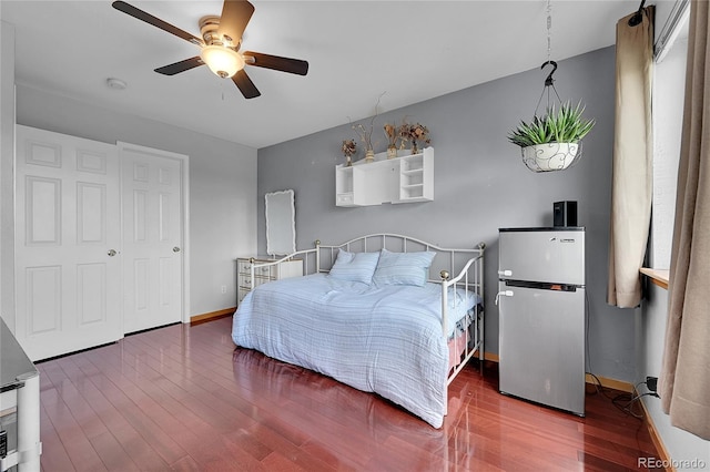 2850 Aurora Ave Unit 301, Boulder, CO 80303 - bedroom featuring freestanding refrigerator, wood finished floors, and a ceiling fan