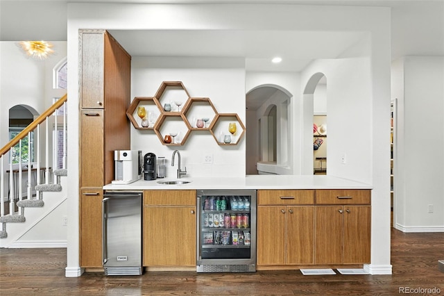 5731 S Yampa St, Centennial, CO 80015 - indoor wet bar featuring beverage cooler, dark wood-style flooring, stairway, recessed lighting, and refrigerator