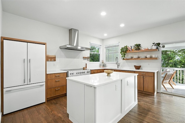 5731 S Yampa St, Centennial, CO 80015 - kitchen with wall chimney range hood, white appliances, open shelves, backsplash, and brown cabinetry